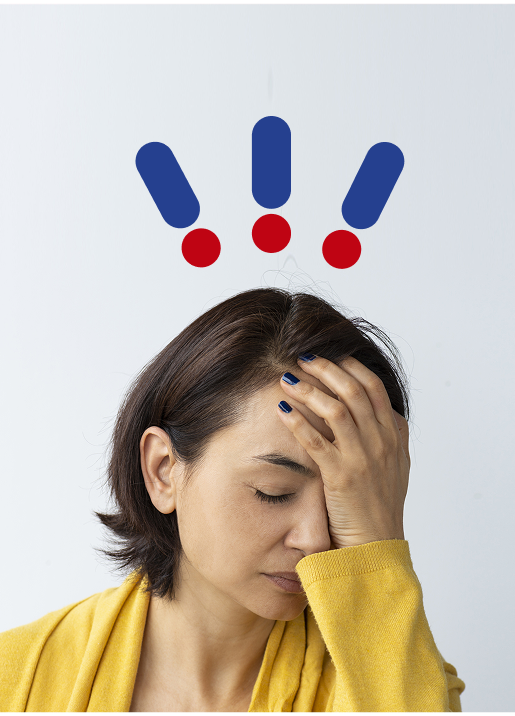 Woman with hand on head and expression of pain